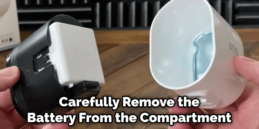 Carefully Remove the Battery From the Compartment