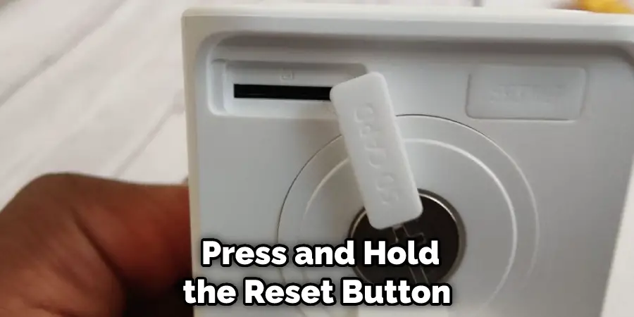  Press and Hold the Reset Button 