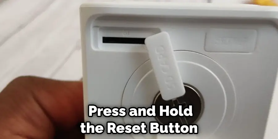 Press and Hold the Reset Button