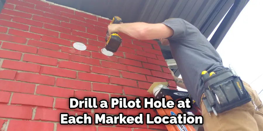 Drill a Pilot Hole at Each Marked Location