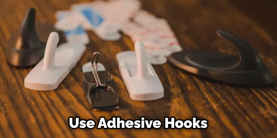 Use Adhesive Hooks