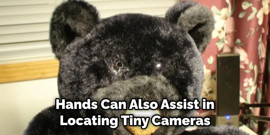 Hands Can Also Assist in Locating Tiny Cameras