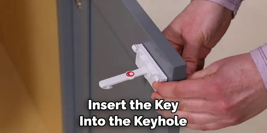 Insert the Key Into the Keyhole