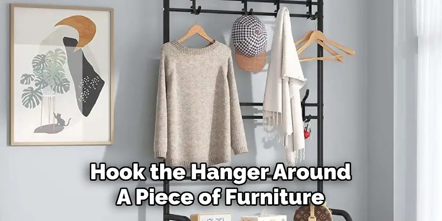 Hook the Hanger Around 
A Piece of Furniture