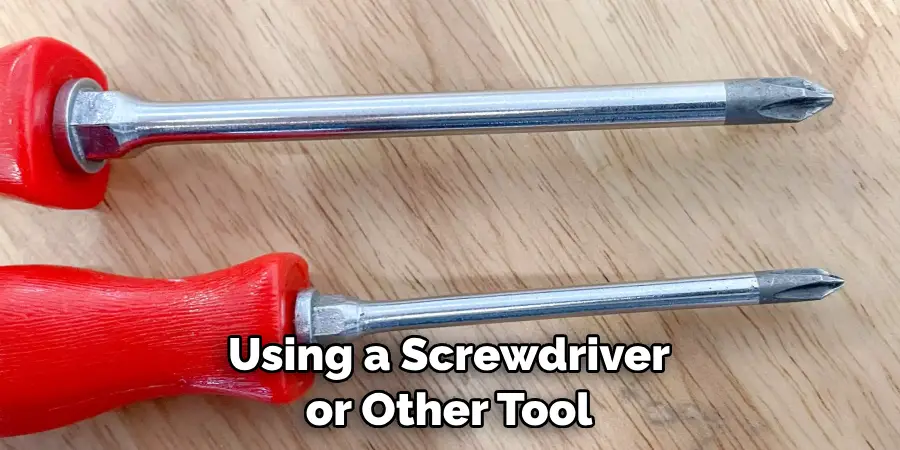 Using a Screwdriver or Other Tool