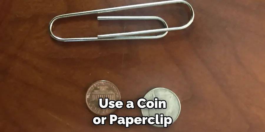 Use a Coin or Paperclip