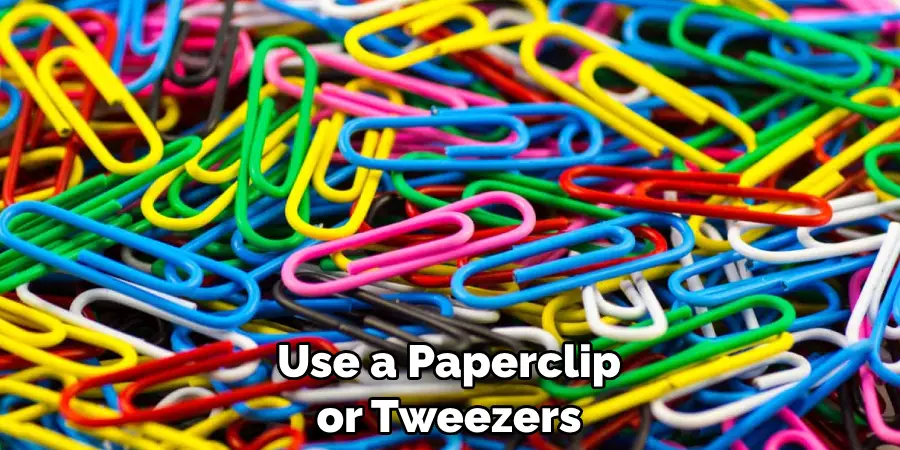 Use a Paperclip or Tweezers