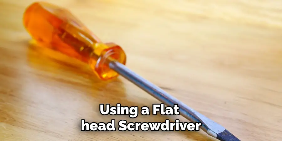  Using a Flat head Screwdriver