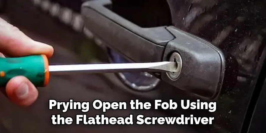 Prying Open the Fob Using the Flathead Screwdriver
