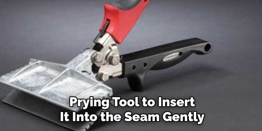 Prying Tool to Insert It Into the Seam Gently