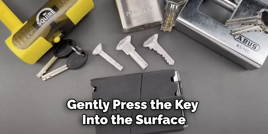 Gently Press the Key 
Into the Surface