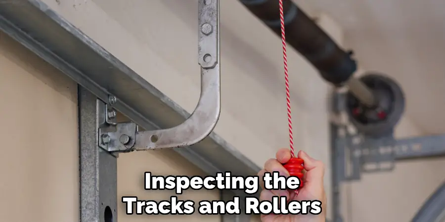 Inspecting the
Tracks and Rollers