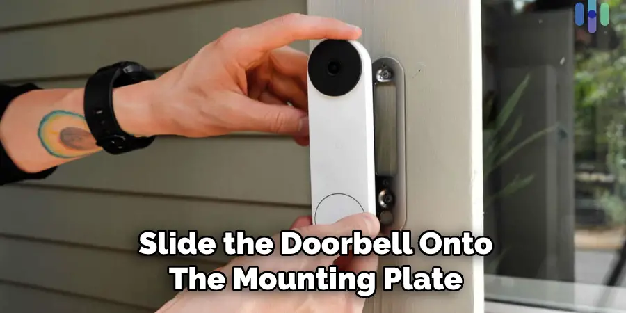 Slide the Doorbell Onto
The Mounting Plate