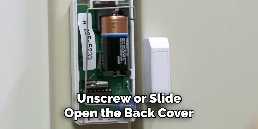 Unscrew or Slide Open the Back Cover