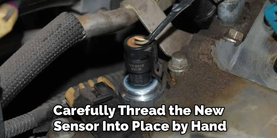 Carefully Thread the New
Sensor Into Place by Hand