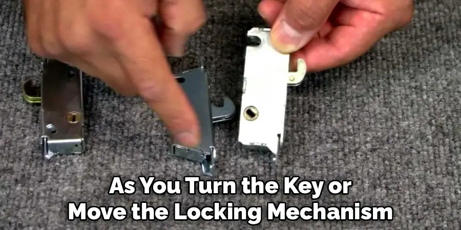 As You Turn the Key or
Move the Locking Mechanism