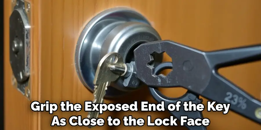Grip the Exposed End of the Key
As Close to the Lock Face