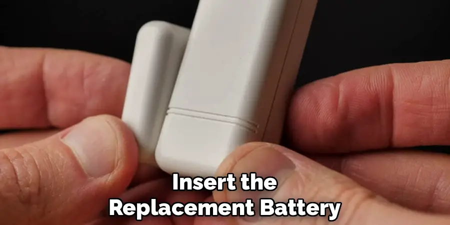 Insert the
Replacement Battery