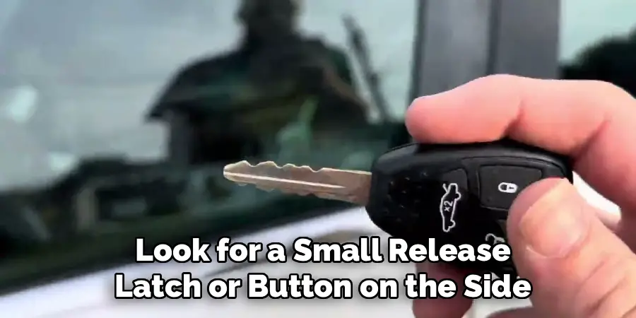 Look for a Small Release
Latch or Button on the Side