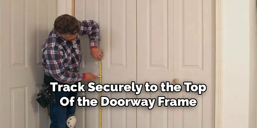 Track Securely to the Top
Of the Doorway Frame